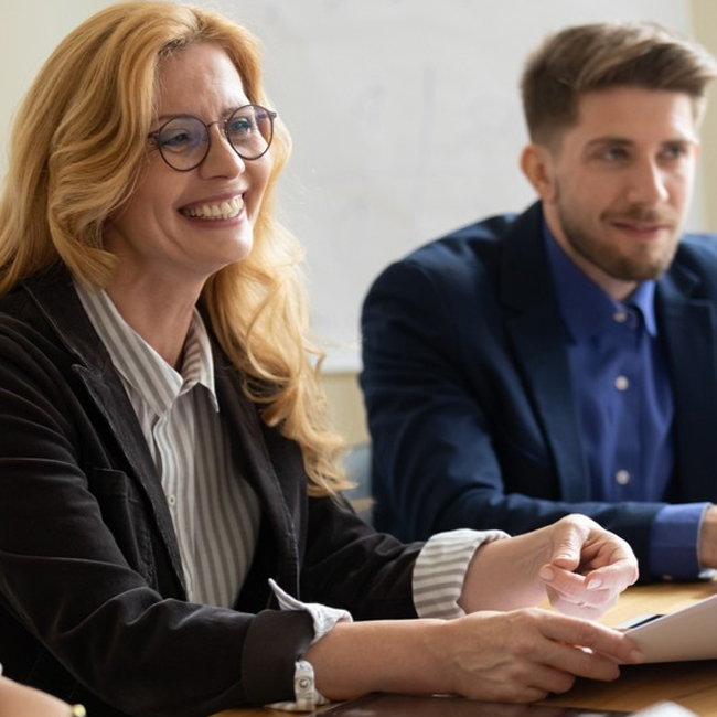 Professional female smiling in a meeting